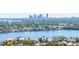 Waterfront view of luxury homes and lush landscaping, set against a backdrop of a vibrant cityscape at 1508 Eden Isle Ne Blvd, St Petersburg, FL 33704
