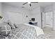 Comfortable bedroom featuring a large bed, work station, and closet with plenty of storage space at 1537 Ember Ln, Tarpon Springs, FL 34689