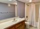 Standard bathroom with a single sink, toilet, and shower with a shower curtain at 1655 S Highland Ave # I286, Clearwater, FL 33756