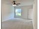 Serene bedroom with neutral carpet, a large window, and ample natural light at 1655 S Highland Ave # I286, Clearwater, FL 33756
