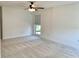 Spacious bedroom with carpet, ceiling fan, and natural light at 1655 S Highland Ave # I286, Clearwater, FL 33756