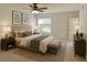 Well-furnished bedroom featuring a ceiling fan and scenic outside view at 1655 S Highland Ave # I286, Clearwater, FL 33756