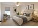 Bright bedroom with ceiling fan, plush rug, stylish art, and coordinating bedside tables with lamps at 1655 S Highland Ave # I286, Clearwater, FL 33756