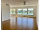 Spacious living room with wood floors and large windows offering scenic waterfront views at 1655 S Highland Ave # I286, Clearwater, FL 33756