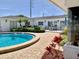 Inviting pool area featuring outdoor seating and lush landscaping, perfect for relaxation and entertainment at 1655 S Highland Ave # I286, Clearwater, FL 33756