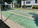 Community shuffleboard courts with white-painted lines and landscaping, and nearby condo buildings at 1655 S Highland Ave # I286, Clearwater, FL 33756