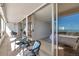 Balcony with seating and views, with access to bedroom and living area through sliding glass doors at 17920 Gulf Blvd # 2004, Redington Shores, FL 33708