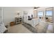 Cozy bedroom with ocean views, soft textures, and access to the balcony at 17920 Gulf Blvd # 2004, Redington Shores, FL 33708