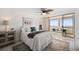 Comfortable bedroom with ocean view, stylish rug, and access to outdoor balcony at 17920 Gulf Blvd # 2004, Redington Shores, FL 33708