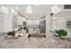 Bright kitchen boasts white cabinets, granite countertops, and stainless steel appliances at 17920 Gulf Blvd # 2004, Redington Shores, FL 33708