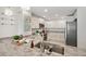 Bright kitchen with granite countertops, modern appliances, and ample cabinet space at 17920 Gulf Blvd # 2004, Redington Shores, FL 33708