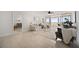 Bright living room offers ocean views, comfortable seating, and seamless access to adjacent rooms at 17920 Gulf Blvd # 2004, Redington Shores, FL 33708