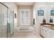 Bright bathroom with a shower, tub, and white cabinets with granite countertops at 18241 Autumn Lake Blvd, Hudson, FL 34667