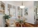 Bright breakfast nook with shutters and a glass table with comfortable chairs at 18241 Autumn Lake Blvd, Hudson, FL 34667