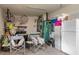 Spacious garage with storage solutions and a utility refrigerator for added convenience at 18241 Autumn Lake Blvd, Hudson, FL 34667