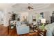 Inviting living room features hardwood floors, tray ceilings, and a seamless connection to the outdoor space at 18241 Autumn Lake Blvd, Hudson, FL 34667
