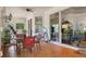 Inviting patio featuring tile flooring, ceiling fan, large windows, and an adjacent living area at 18241 Autumn Lake Blvd, Hudson, FL 34667