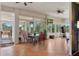 Spacious sunroom with tile flooring, ceiling fan, and large windows providing ample natural light at 18241 Autumn Lake Blvd, Hudson, FL 34667