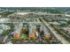 Aerial view of a condo community, parking lots, and commercial buildings at 1900 68Th N St # 110, St Petersburg, FL 33710