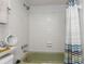 Clean bathroom with tiled walls and a shower/tub with a decorative shower curtain at 1900 68Th N St # 110, St Petersburg, FL 33710