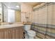 Bathroom with vanity, toilet, and a shower/tub with a decorative shower curtain at 1900 68Th N St # 110, St Petersburg, FL 33710