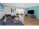 Bright living room offers wood floors, large window, and decorative furnishings at 1900 68Th N St # 110, St Petersburg, FL 33710