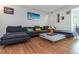 Relaxing living room provides a comfortable sectional sofa and decor at 1900 68Th N St # 110, St Petersburg, FL 33710
