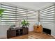 Sunroom area with light-filtering shades and wooden floors at 1900 68Th N St # 110, St Petersburg, FL 33710