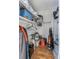 Walk-in closet with shelving, various storage items, and laminate wood flooring at 1900 68Th N St # 110, St Petersburg, FL 33710