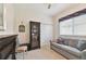 Bright bedroom with neutral walls, carpet floors, and a cozy sitting area by the window at 2159 Warwick Dr, Oldsmar, FL 34677