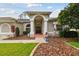 Inviting front entrance with columns and double doors offering curb appeal at 2159 Warwick Dr, Oldsmar, FL 34677