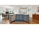 Kitchen island with sink and dishwasher in an open-concept living space at 2159 Warwick Dr, Oldsmar, FL 34677