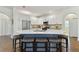 Spacious kitchen featuring white cabinets, stainless steel appliances, and an island with seating at 2159 Warwick Dr, Oldsmar, FL 34677