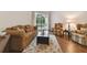 Cozy living room with comfortable seating and view of the screened patio at 2159 Warwick Dr, Oldsmar, FL 34677