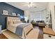 Spacious main bedroom with hardwood floors, a work station, and a sitting area with lots of light at 2159 Warwick Dr, Oldsmar, FL 34677