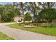 Neighborhood entrance with manicured landscaping and the community name sign at 2159 Warwick Dr, Oldsmar, FL 34677