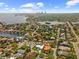An aerial view of a neighborhood with the subject property marked by a red pin, showcasing proximity to the city skyline at 219 Rialto Ne Way, St Petersburg, FL 33704