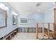 Bathroom undergoing renovations with light blue walls, exposed framework, and plumbing at 219 Rialto Ne Way, St Petersburg, FL 33704
