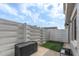 Cozy backyard with modern privacy fence and artificial turf at 2647 Barksdale Ct, Clearwater, FL 33761