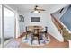 The dining room has a round table, modern chandelier, and access to backyard at 2647 Barksdale Ct, Clearwater, FL 33761