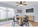 Stylish dining area featuring a round table, modern chairs, and a sliding glass door to the patio at 2647 Barksdale Ct, Clearwater, FL 33761