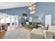 Bright and spacious living room with high ceilings, french doors to patio, and comfortable seating at 2647 Barksdale Ct, Clearwater, FL 33761
