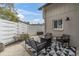 Relaxing outdoor patio area with modern furniture, a fire pit, and a stylish privacy fence at 2647 Barksdale Ct, Clearwater, FL 33761