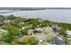 An aerial view of the coastal community showcasing waterfront homes and lush landscaping near the bay at 3027 Key Harbor Dr, Safety Harbor, FL 34695