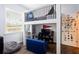 bedroom area with lofted bed, decor, shelving and seating areas for study and relaxing at 3027 Key Harbor Dr, Safety Harbor, FL 34695
