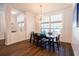 Elegant dining room with modern lighting, wainscoting, and large windows that provide ample natural light at 3027 Key Harbor Dr, Safety Harbor, FL 34695
