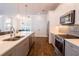 Bright kitchen features a large island, stainless appliances, and stylish backsplash at 3027 Key Harbor Dr, Safety Harbor, FL 34695
