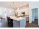 Charming kitchen featuring a large island with pendant lighting and stainless appliances at 3027 Key Harbor Dr, Safety Harbor, FL 34695