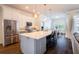 Gourmet kitchen with stainless steel appliances, a large center island, and custom cabinetry at 3027 Key Harbor Dr, Safety Harbor, FL 34695