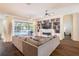 Stylish living room with a fireplace, built-in shelving, and a view of the outdoor pool area at 3027 Key Harbor Dr, Safety Harbor, FL 34695